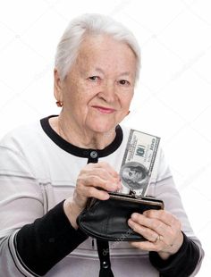 an old woman holding a wallet and money in her hands, on white background stock photo