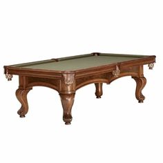 an antique pool table with green cloth on the top and two drawers at the bottom