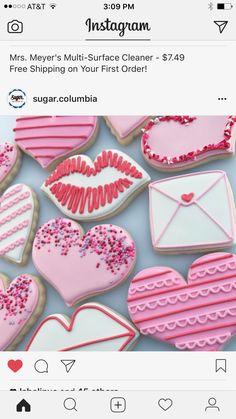 cookies decorated with pink and white icing on top of each other, in the shape of hearts