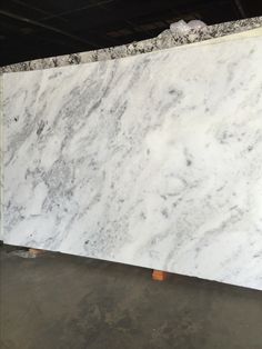 a large marble slab is shown in the warehouse, ready to be used as a counter top