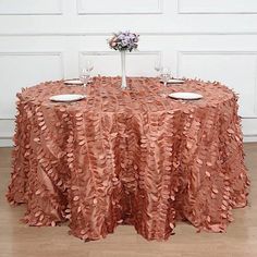 the table is set with two place settings for four people to sit down and eat