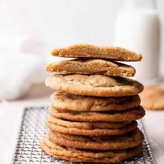 a stack of cookies sitting on top of a cooling rack