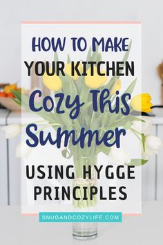 a vase filled with yellow tulips on top of a table next to a sign that says, how to make your kitchen cozy this summer using hy hy - hyge pring