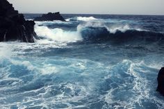 the ocean is full of blue water and foamy waves