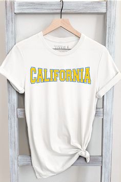 CALIFORNIA GRAPHIC TEE     Our Shirts are Authentically Designed and Hand Screen Printed for Best Quality    *Process where the ink is dyed into the shirt and graphic will not peel away     -Proudly Hand Pressed in Los Angeles, CA.     -30 Singles. 100% Washed Cotton     -Comfortable and Very Soft    -Style by Rolling up the Sleeves, Tie a Side Knot, Front Tuck...       SIZE AND FIT      *Please refer to the last photo option for measurements    WASHING AND CARE    -Machine Wash with Like Colors    -Tumble Dry Low    -Do Not Bleach    -Do Not Dry Clean    -Do Not Iron Directly on Design    *Machine Wash Cold with Like Colors inside out and hang dry for Longevity SHIPPING/PROCESS    -All Items are Made To Order with a turnaround time of 1-5 business days. Shipping can take an additional 3-5 California T Shirt Designs, California Adventure Shirts, West Coast Shirt, California Cities, California Graphic, College Shirt, Travel Apparel