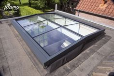 an open roof window on top of a building