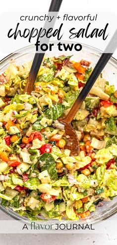 a salad in a glass bowl with two wooden utensils on top and the words crunchy flavorful chopped salad for two