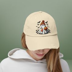 Embrace the spirit of the season with this Retro Spooky Ghost Hat! This cute women's baseball cap is the perfect addition to your Halloween wardrobe. Made from distressed classic cotton, this dad hat exudes vintage vibes with a touch of ghost humor. It's the ultimate trendy teen accessory for the spooky season, adding a playful twist to any outfit. Stand out in style with this Halloween trendy cap and let your love for all things spooky shine through! DT600 District ® Distressed Cap This classic Ghost Humor, Ghost Hat, Trendy Caps, Cute Womens, Dad Fashion, Funny Ghost, Ghost Design, Halloween Charms, Womens Baseball Cap