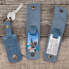 two personalized luggage tags with a keychain attached to them