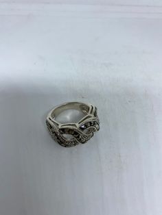 Vintage ring surrounded by Swiss cut fine Marcasite Sterling silver Size 6 can be sized by my jeweler. His service charge is $10-$20 All rings are shipped free in the US in a nice gift box. Check out our over a THOUSAND great reviews Engraving is $4 per letter and is not always perfect depending on the piece. It can take a few days if the jeweler is busy. This is payable to Paypal Judithsltd@gmail.com Silver Marcasite Ring, Antique Silver Ornate Rings For Anniversary, Silver Marcasite Jewelry Stamped 925, Ornate Antique Silver Rings For Anniversary, Ornate Silver Jewelry With Accent Stones, Silver Sterling Diamond Ring With Stone Setting, Silver Open Ring With Accent Stones, Silver Crystal Ring With Stone Setting For Anniversary, Elegant Silver Marcasite Rings