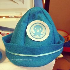 a blue hat with an octopus on it