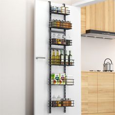 a kitchen with an open pantry door and shelving unit