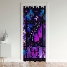 an open door with purple and blue butterflies on it