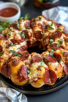 a pepperoni pizza bundt cake on a black plate