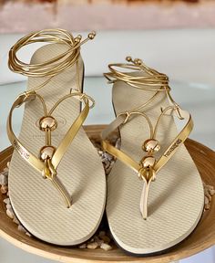 Glamour at your feet! All sandals are handcrafted with the finest Brazilian embellishments. We use the original Havaianas®️: thong style made in Brazil 100% rubber non slip tread durable and flexible Customized items are final sale so they can’t be returned. Gold Toe Post Flip Flops For Vacation, Elegant Gold T-strap Sandals For Beach, Elegant Adjustable T-strap Sandals For Beach, Adjustable Gold T-strap Sandals For Vacation, Elegant Toe Loop T-strap Sandals For Beach, Elegant Beach T-strap Sandals With Toe Loop, Elegant Beach T-strap Toe Loop Sandals, Gold Adjustable Toe Post T-strap Sandals, Elegant Gold Flip Flops For The Beach