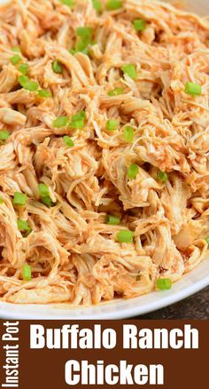 buffalo ranch chicken in a white bowl with green onions and scallions on top