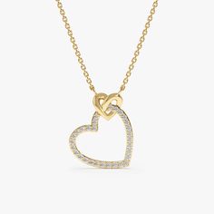 Celebrate the enduring power of love with this captivating Interlocking Heart Diamond Necklace. This exquisite piece features two interlocking heart-shaped pendants, crafted from solid 14k gold (available in yellow, white, or rose gold). One heart shimmers with sparkling diamonds, adding a touch of brilliance and everlasting love, nestled in the embrace of a smaller, smooth gold heart. - Handmade - Solid Gold - Natural Diamonds  - G Color, SI Quality Diamonds - Total Diamond Carat Weight: 0.15 ctw - Pendant Size: 12 mm x 14 mm 🛠 Your Sarah Elise piece is handcrafted with care! Ready-to-ship items go out within 3 business days. Made-to-order pieces typically take 7-10 business days to create. If you need something sooner, please contact us - we'll see if we can make it happen! For estimate White Gold Promise Necklace For Valentine's Day, Elegant Heart Necklace With Adjustable Chain For Anniversary, Promise Necklace With Heart Pendant, Heart Pendant Necklace With Heart Charm For Promise, Anniversary Heart Pendant Necklace With Cable Chain, White Gold Necklaces For Valentine's Day Promise, White Gold Necklace For Valentine's Day Promise, Promise Heart Pendant Necklace With Heart Charm, Heart-shaped Necklace For Mother's Day Promise