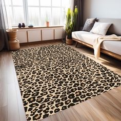 a living room with a couch, rug and window in the background that has a leopard print on it