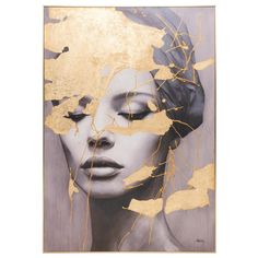 a painting with gold foil on it and a woman's face in the background