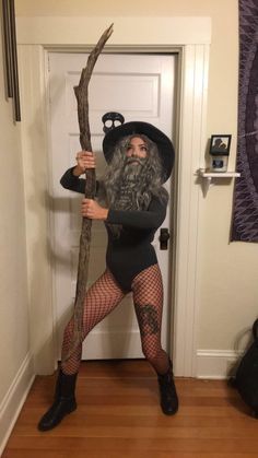 a woman dressed as an old man holding a stick with the caption costume from the waist up hooker from the waist down