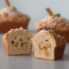 some muffins are cut in half on a table