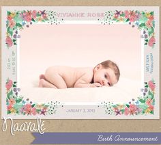 a baby laying on top of a bed in front of a pink background with flowers