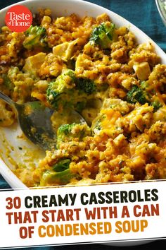 broccoli and cheese casserole in a white dish with a serving spoon