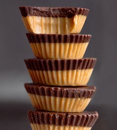 three chocolate cups stacked on top of each other with peanut butter in the middle,