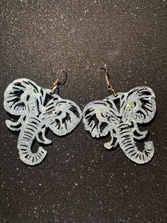 These exquisite elephant earrings are designed to add a touch of elegance and whimsy to any outfit. Crafted with high-quality materials, they feature a stunning glitter finish that catches the light beautifully, making them perfect for both casual and formal occasions. The intricate detailing of the elephants showcases a blend of artistry and charm, ensuring that these earrings will be a standout accessory in your jewelry collection. Elephant Earrings, Favorite Jewelry, Jewelry Earrings Dangle, D Art, Etsy Earrings, Dangle Drop Earrings, Jewelry Collection, Wedding Gifts, Dangle Earrings