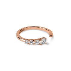 a rose gold ring with three stones