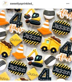 decorated cookies with construction theme are displayed on a sheet of white paper that says 4 for jackson