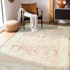 a living room area with a chair and rug