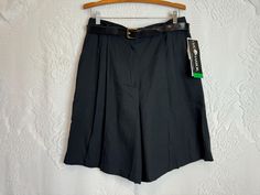 A beautiful pair of pleated black trousers shorts, unworn with the original retail hangtags still attached. Includes original belt! Slit pockets at the hips. A poly/rayon blend that has the feel of linen. Vintage brand Sag Harbor. 50% polyester 50% rayon. Tag size 18 23" Long 10" Inseam 34" Waist 48" Hips Bundle Discount Get 10% off when you purchase two or more items from Terra Exchange with code TERRABUNDLE FREE SHIPPING! On any order totaling $35 or more (only valid within the U.S.) 90s Dark Academia, Trouser Shorts, Short Noir, Black Plus Size, Sag Harbor, Black Trousers, Vintage Branding, Skorts, Shorts Black