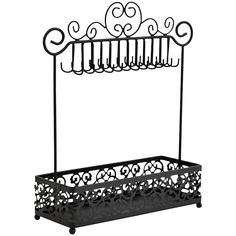 a black metal rack with wrought designs on it