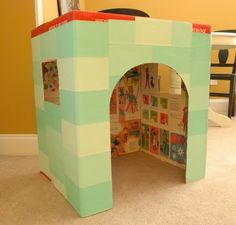 a child's play house made out of cardboard