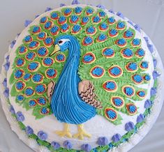 there is a peacock cake on the table