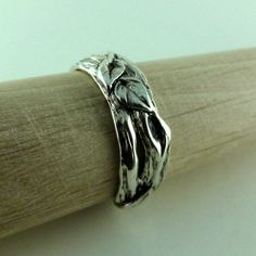 One-of-a-Kind Men's Sterling Silver Leaf & Twig Wedding Band NOTE: Each ring is Made-to-Order in the size needed. Material: Sterling Silver 92.5 Finish Shown: Light Oxidized (shown) it just brings out the depth and detail in the ring. Width: 8mm wide (widest Point) Hand sculpted twig band with 3 leaves, Continuous 360 design. This is a growing line for me, I love going into my studio and just start sculpting, something about the texture and leaves makes designing these pieces is so calming t Nature-inspired Engraved Wedding Rings, Spiritual Hand Cast Rings For Anniversary, Handmade Silver Bands For Wedding, Anniversary Rings With Hand Cast Wide Band, Hand Cast Sterling Silver Engraved Ring For Wedding, Wide Band Hand Cast Rings For Anniversary, Anniversary Hand Cast Wide Band Rings, Nature-inspired Anniversary Rings With Polished Finish, Nature-inspired Hand Cast Wedding Rings