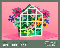 a card with flowers and a house cut out of it's side on a pink background