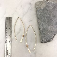 These hand-forged lightweight threader earrings go perfectly with any outfit. These 14 k gold fill drops measure in at a little over two inches. Simple and elegant. An absolute crowd pleaser! Available in any combination of sterling silver, gold fill or rose gold fill. Please convo me for a different metal combination. Your Rachel Dawn Designs piece will come in a recycled box topped with a bow for you or a friend! PLEASE note this is handmade jewelry. There will be slight differences as each pi Adjustable Minimalist Threader Earrings For Everyday, Minimalist Metal Dangle Threader Earrings, Minimalist Metal Long Drop Threader Earrings, Minimalist Long Drop Hoop Earrings For Everyday, Everyday Minimalist Long Drop Hoop Earrings, Dainty Teardrop Threader Earrings For Everyday, Dainty Teardrop Threader Earrings, Minimalist 14k Gold Filled Nickel-free Threader Earrings, Minimalist Nickel-free 14k Gold-filled Threader Earrings