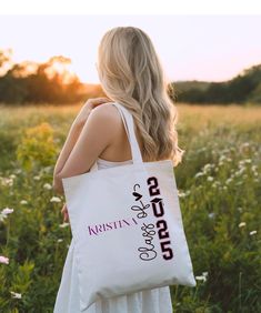 Mark the milestone of graduation with a personalized tote bag designed to celebrate the class of 2025! This stylish and practical tote is the perfect way for graduates to carry their essentials while showcasing their unique achievement and school pride. Product Features: Material: 100% Cotton Canvas - strong, durable, and perfect for everyday use. Dimensions: 15" x 16" - ideal for carrying books, groceries, or everyday items. Fabric Weight: Heavy fabric (12 oz/yd² or 406.9 g/m²) - built to withs Personalized White Canvas Bag For School, White Rectangular Bag For Graduation Gift, Class Of 2025, Graduation Year, Custom Tote Bags, School Pride, School Colors, Everyday Items, School Spirit