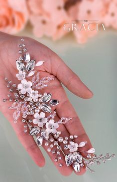 a woman's hand holding a bunch of flowers on her left hand, with the words grace written across it