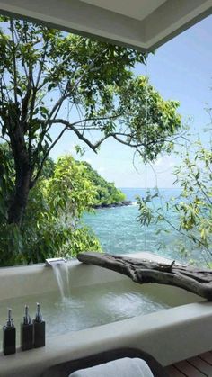 an outdoor jacuzzi tub overlooking the ocean