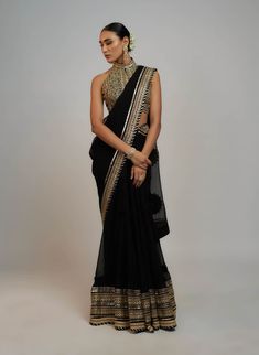 Editor's Note A classic drape sari with delicate gold embroidery lifts the patterns and add grace, paired with a beautiful bralette blouse speaks of opulence and grandeur, gold, jewel colours that are reminiscent of royalty! Drape Sari, Jewel Colours, Indian Arts And Crafts, Personal Shopping Service, Black Drapes, Jewel Colors, Gold Embroidery, Indian Design, Handmade Clothes