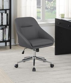 a gray office chair sitting on top of a white rug