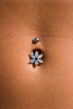 an image of a woman's stomach with jewels on it