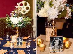 the table is set with flowers, candles and film reel pictures for guests to take photos