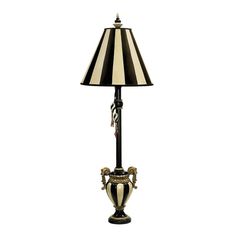 a black and white lamp with a striped shade on it