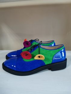 "Perfect your modern look for any occasion with these women's leather and suede oxford shoes. We use only high quality genuine leather to deliver the best result. PRODUCT INFORMATION * High quality leather, suede and patent leather upper (available in a variety of colors) * Blue patent leather / blue suede / green suede / multicolor flowers * Smooth and breathable leather lining * Lace-up design * Round toe * Lightly padded footbed footbed for all-day comfort * Man-made outsole * Heel: 2.5 cm / Leather Shoes For Derby In Spring, Spring Leather Shoes For Derby, Blue Oxfords With Brogue Detailing For Spring, Blue Round Toe Oxfords For Spring, Spring Blue Oxfords With Brogue Detailing, Blue Brogue Oxfords For Spring, Spring Suede Lace-up Flat Heel Shoes, Spring Suede Lace-up Shoes With Flat Heel, Flat Suede Leather Shoes For Spring