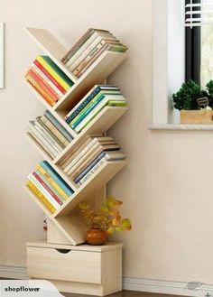 the bookshelf is made out of wooden boxes