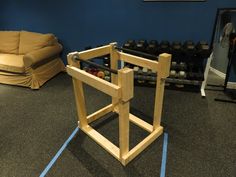 a wooden structure sitting in the middle of a gym